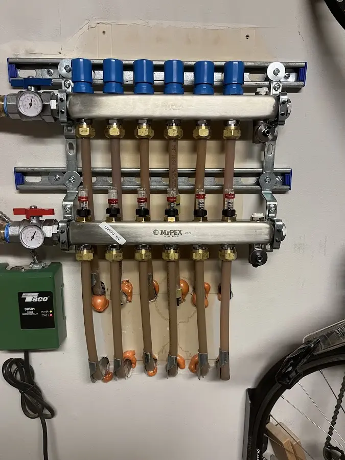 Plumber performing Water Heater Repair at a residential property in Newcomerstown